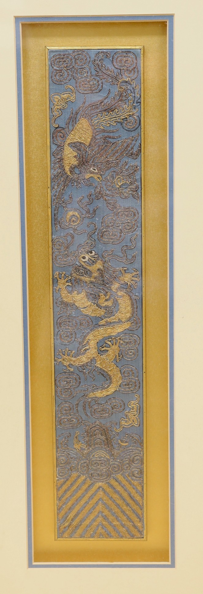 A pair of framed early 20th century Chinese metal thread embroidered ‘dragon’ design sleeve bands, 48x9cms excl frame